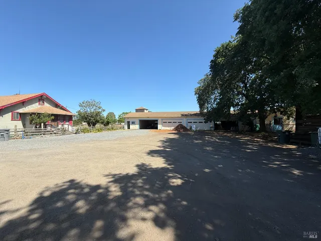 a backyard of a house with lots of green space