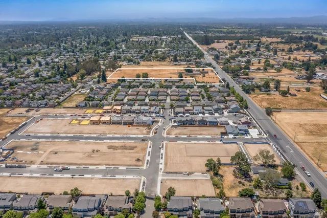an aerial view of residential houses with outdoor space