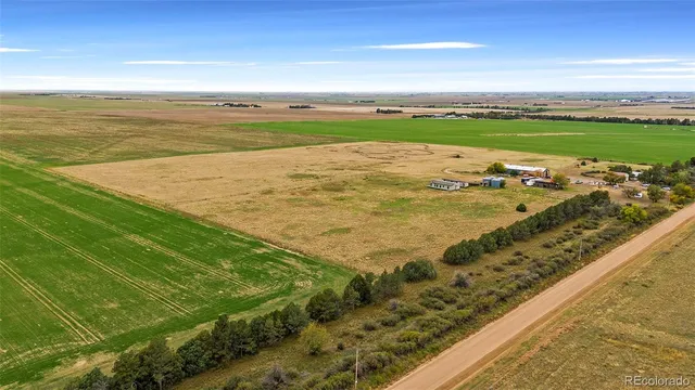 a spacious bathroom with a granite countertop sink and a mirror