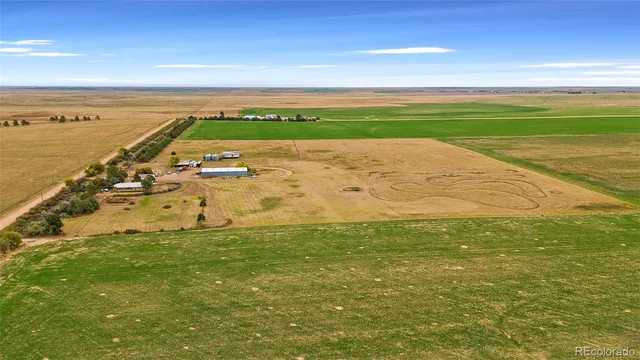 a bathroom with a granite countertop sink and mirror