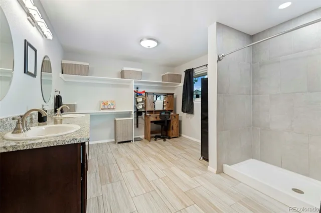 a bedroom with a bed couch and window