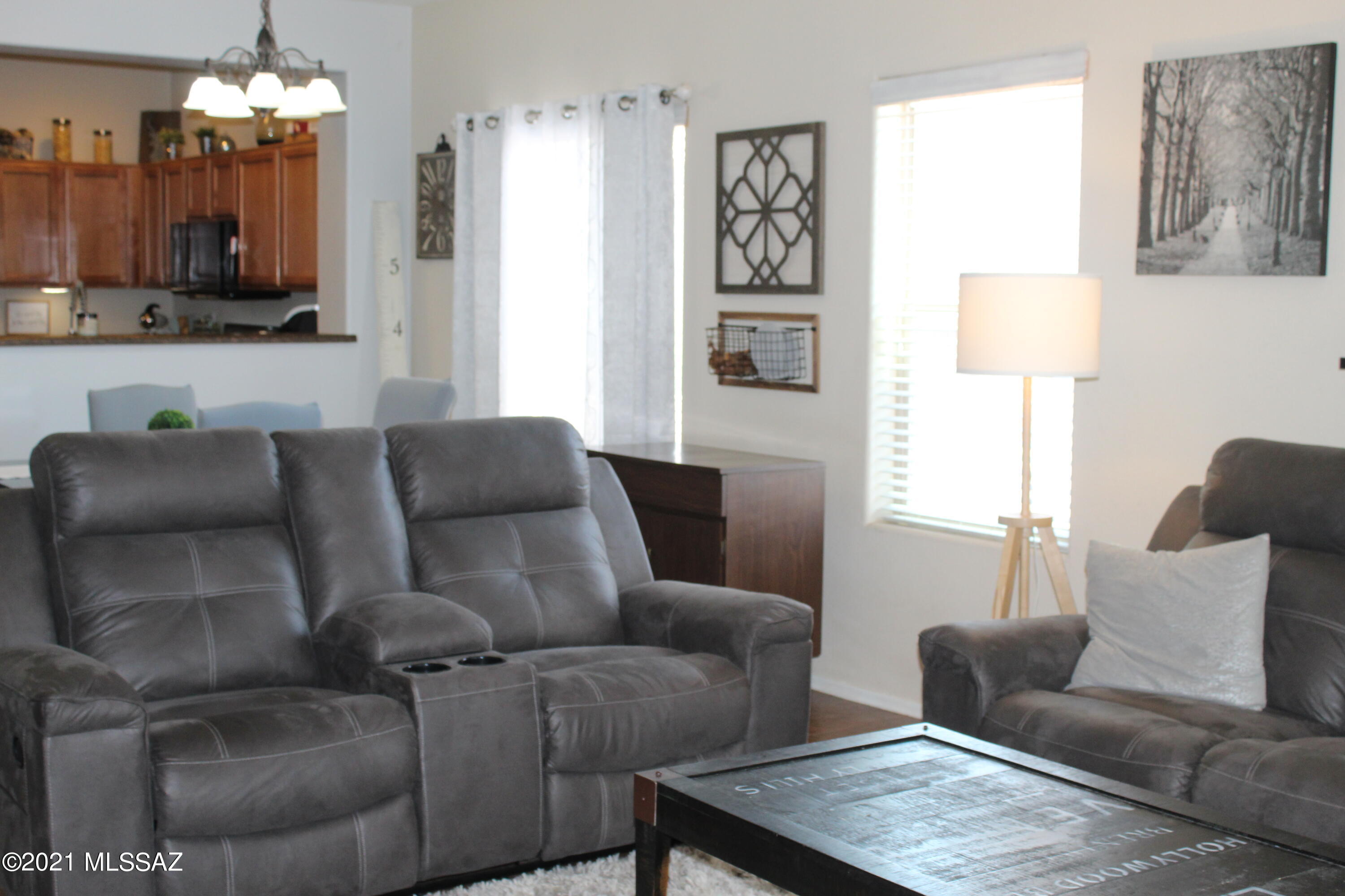20951 East Reunion Road Red Rock, AZ 85145 - Photo 14 of 35 a living room with furniture and a chandelier