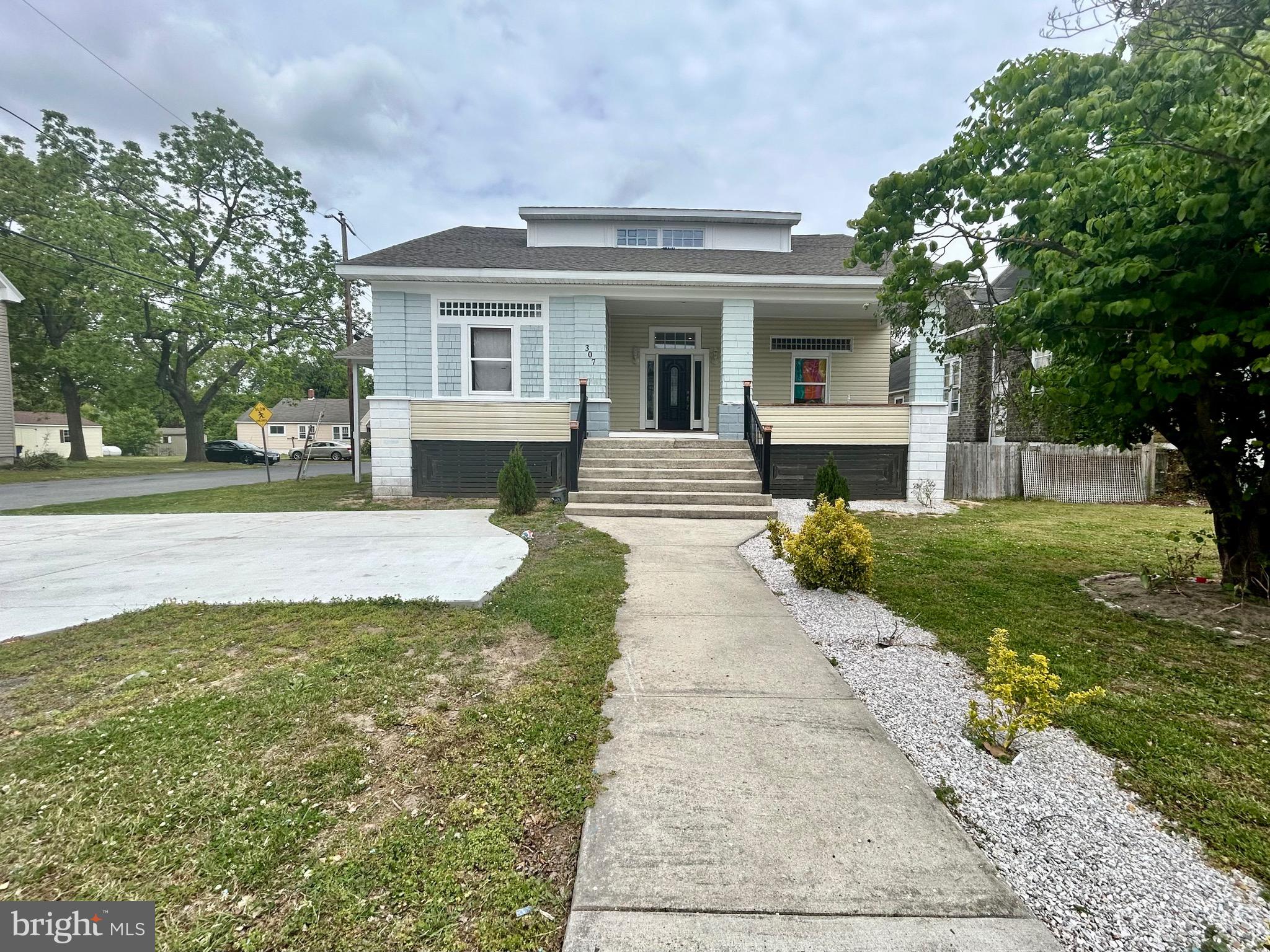 307 South Main Street Hurlock, MD 21643 - Photo 1 of 3 a front view of a house with a yard