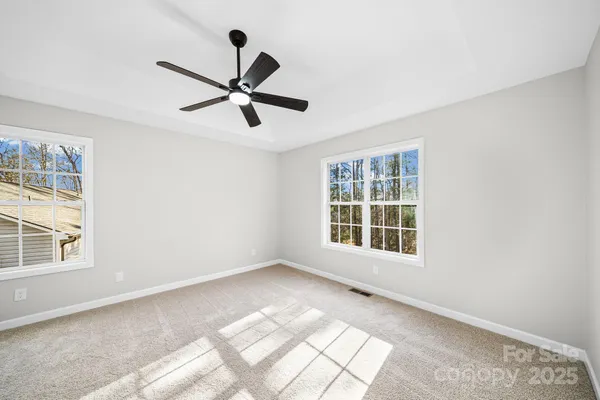 a view of empty room with windows