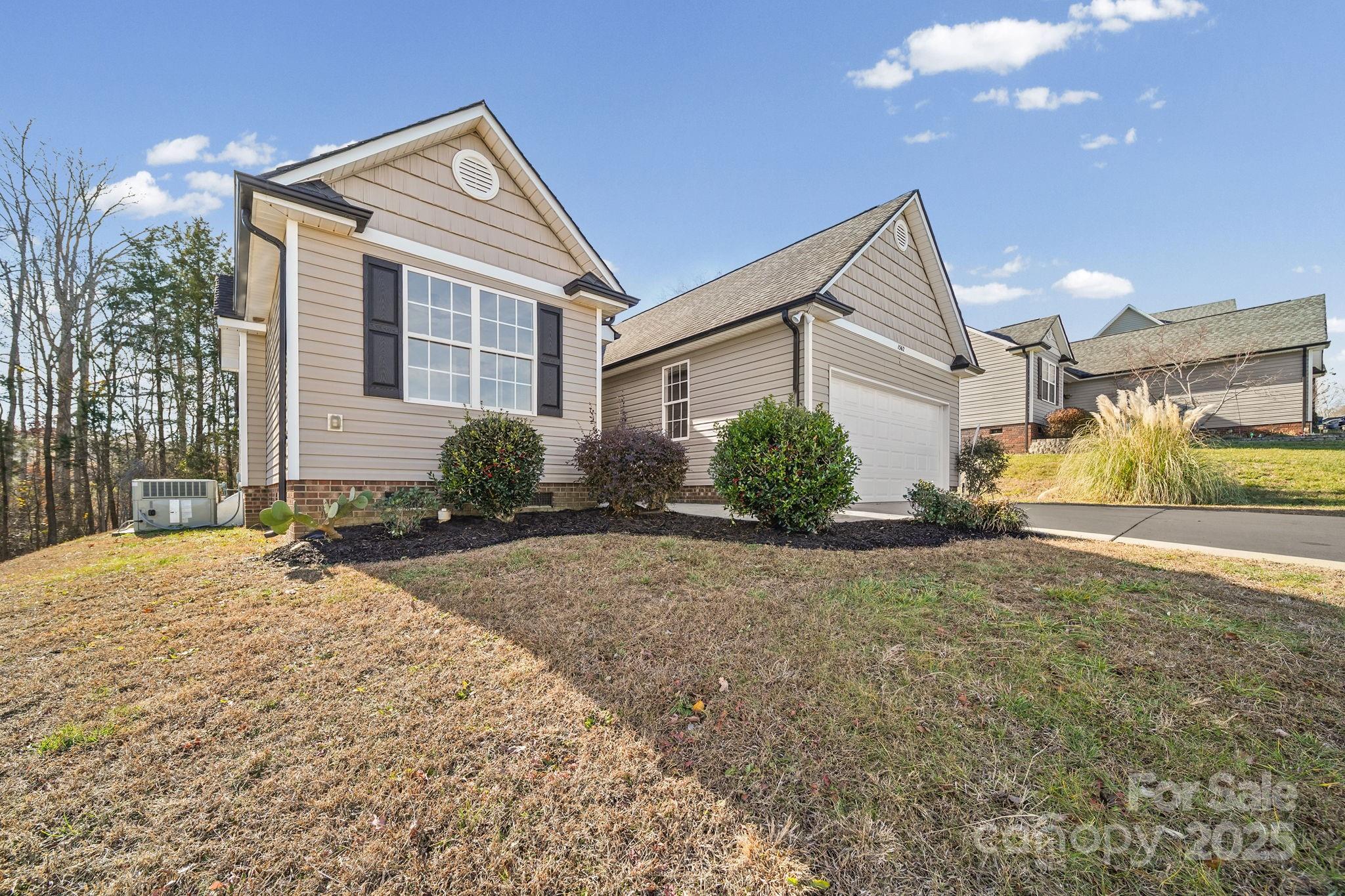 1562 Piney Church Road Concord, NC 28025 - Photo 2 of 40 a front view of a house with a yard and garage