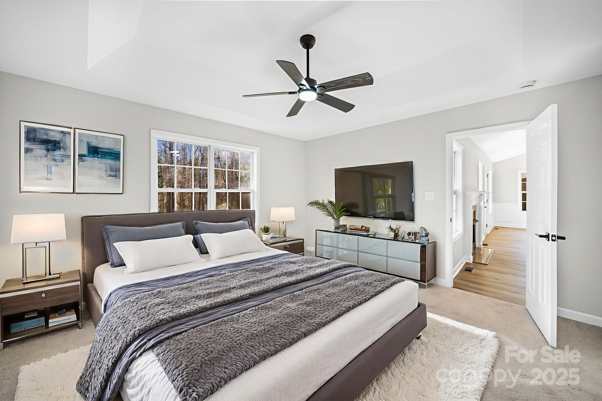 1562 Piney Church Road Concord, NC 28025 - Photo 21 of 40 a bedroom with a bed and a flat screen tv