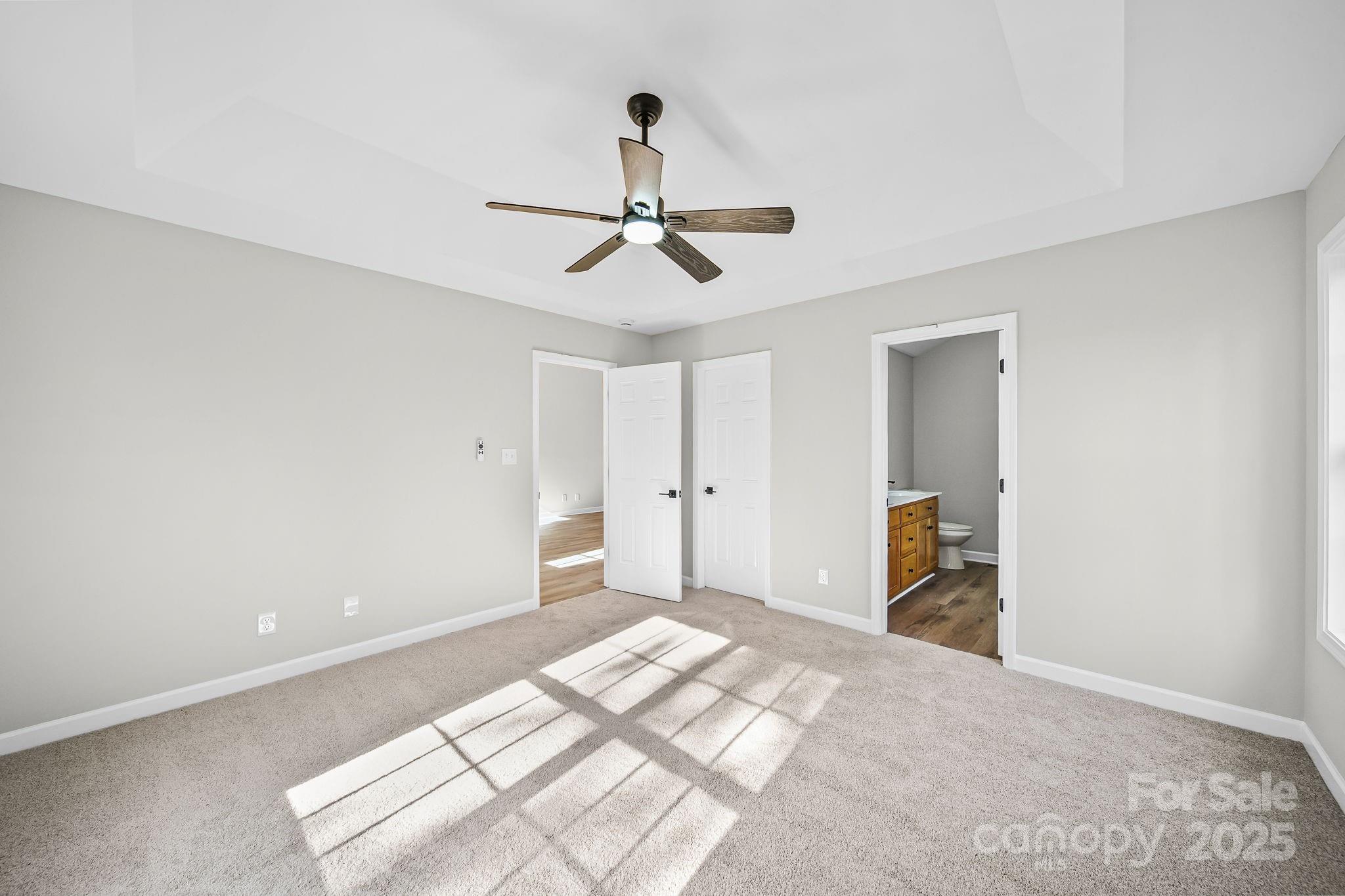 1562 Piney Church Road Concord, NC 28025 - Photo 22 of 40 a bedroom with a bed and a chandelier