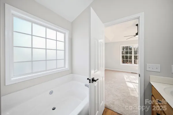 a bathroom with a bathtub and a shower