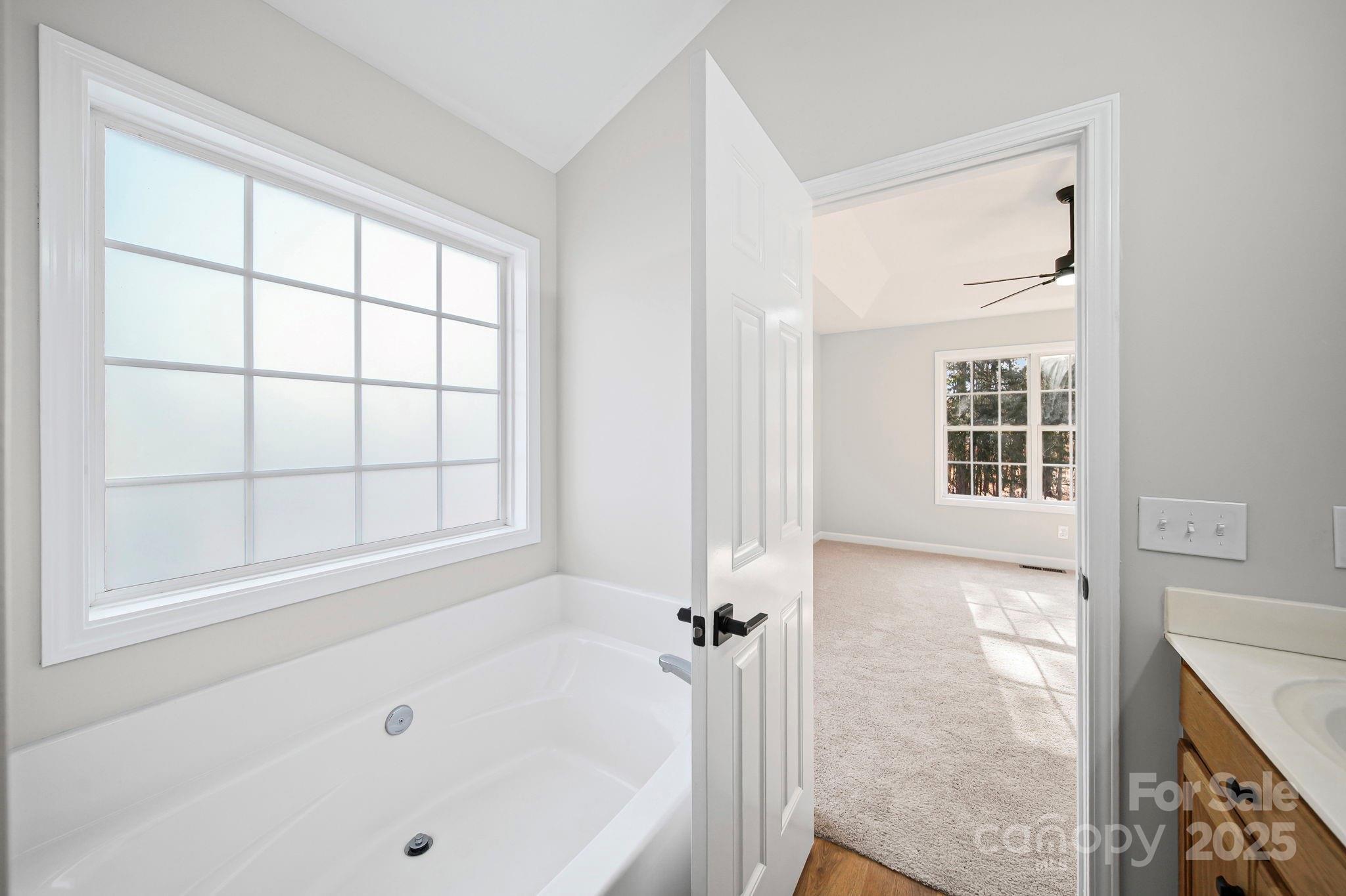1562 Piney Church Road Concord, NC 28025 - Photo 26 of 40 a bathroom with a bathtub and a shower