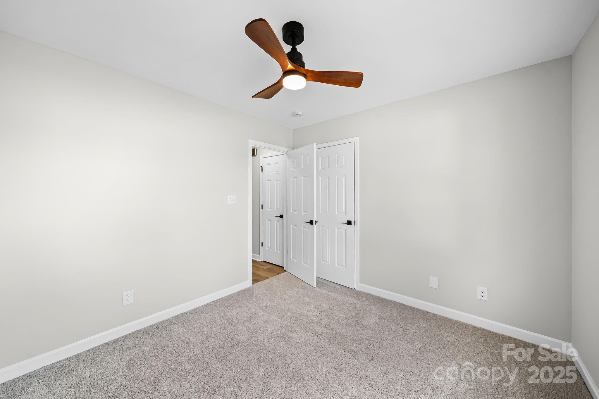 1562 Piney Church Road Concord, NC 28025 - Photo 32 of 40 a view of a livingroom with a ceiling fan