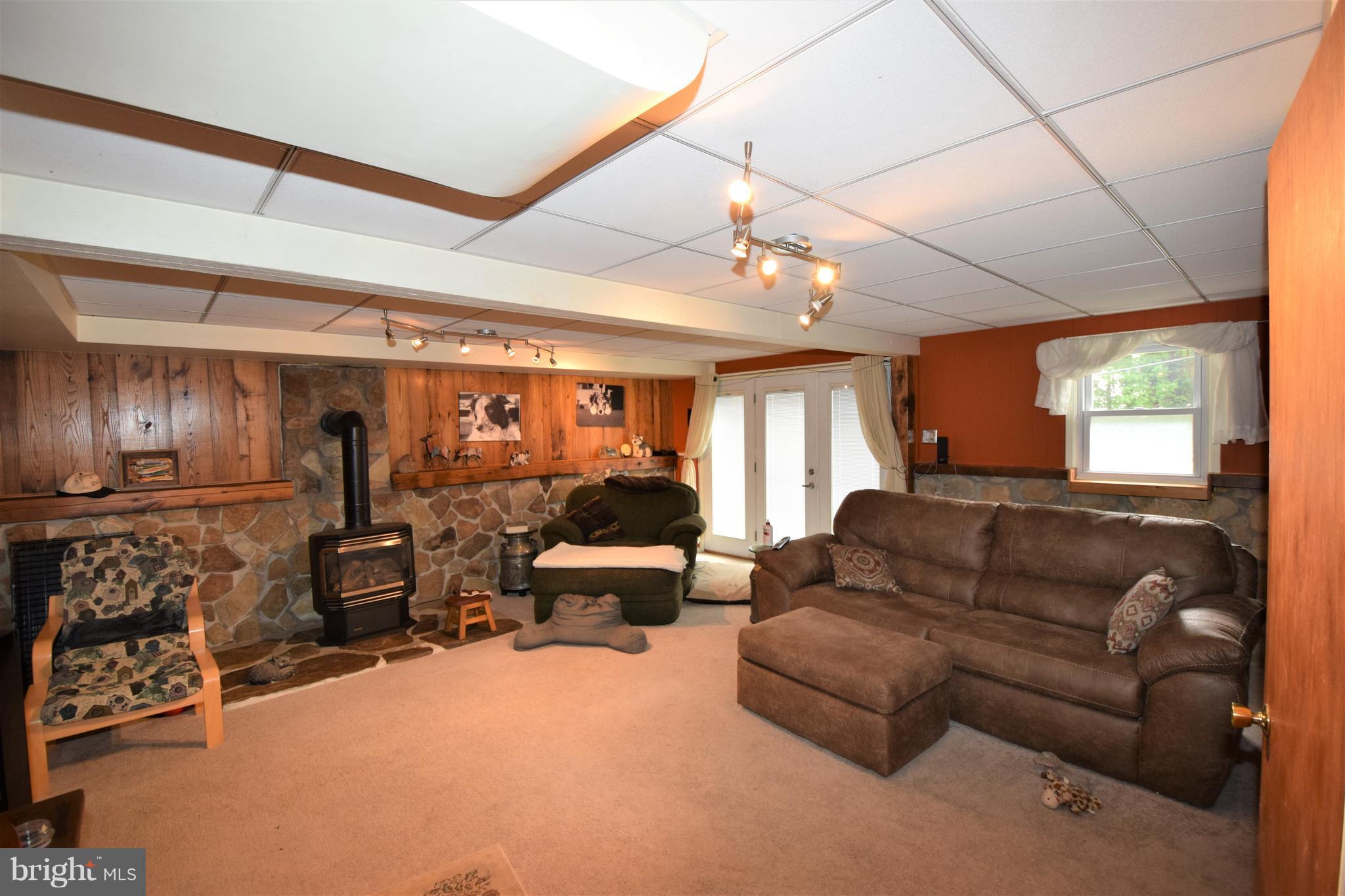 4836 Teen Barnes Road Frederick, MD 21703 - Photo 11 of 29 a living room with furniture a chandelier and a window