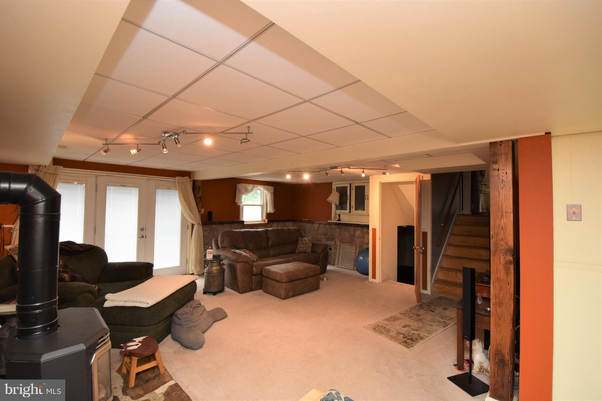 4836 Teen Barnes Road Frederick, MD 21703 - Photo 12 of 29 a living room with furniture and a flat screen tv