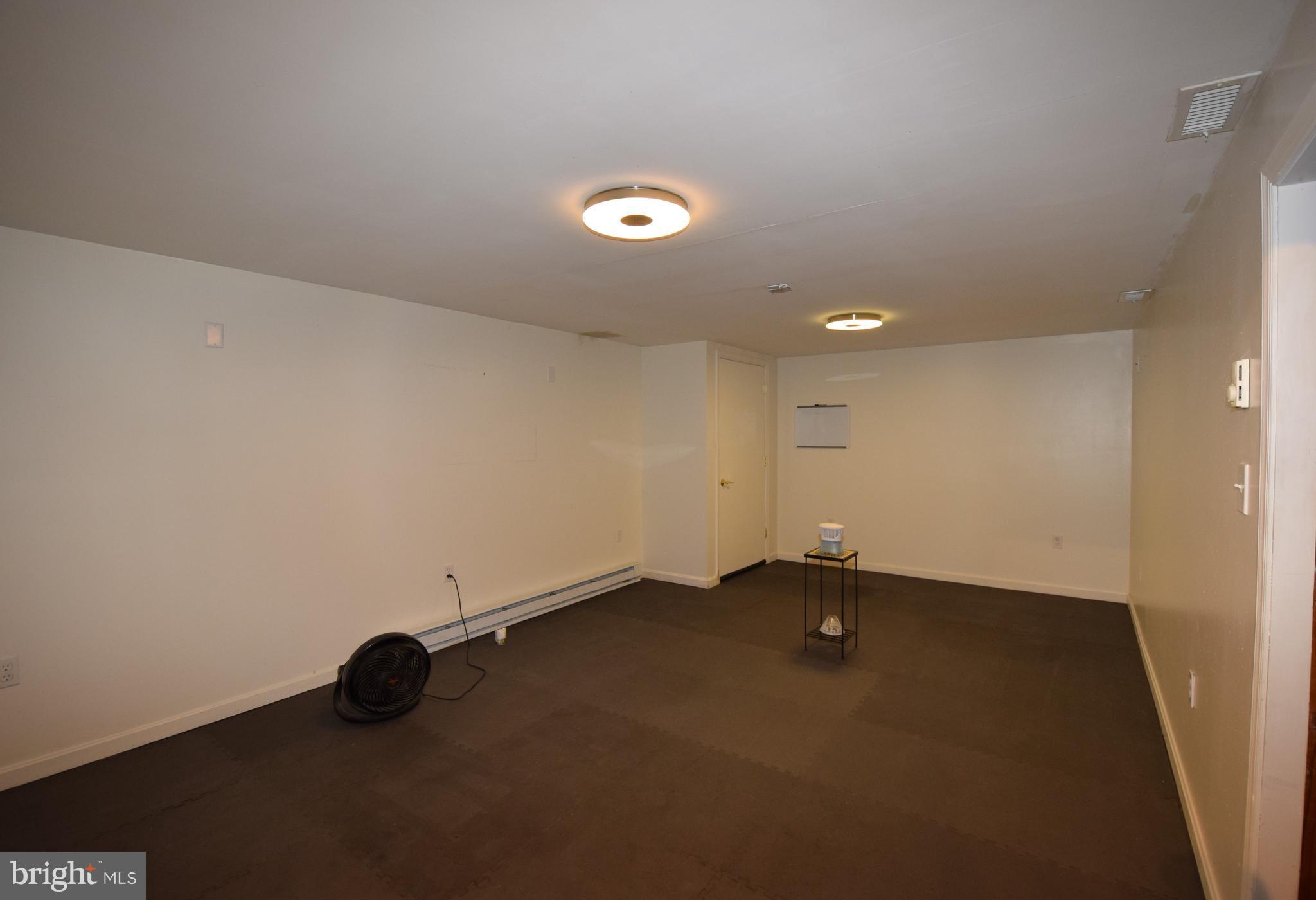 4836 Teen Barnes Road Frederick, MD 21703 - Photo 15 of 29 an empty room with a ceiling fan and a window