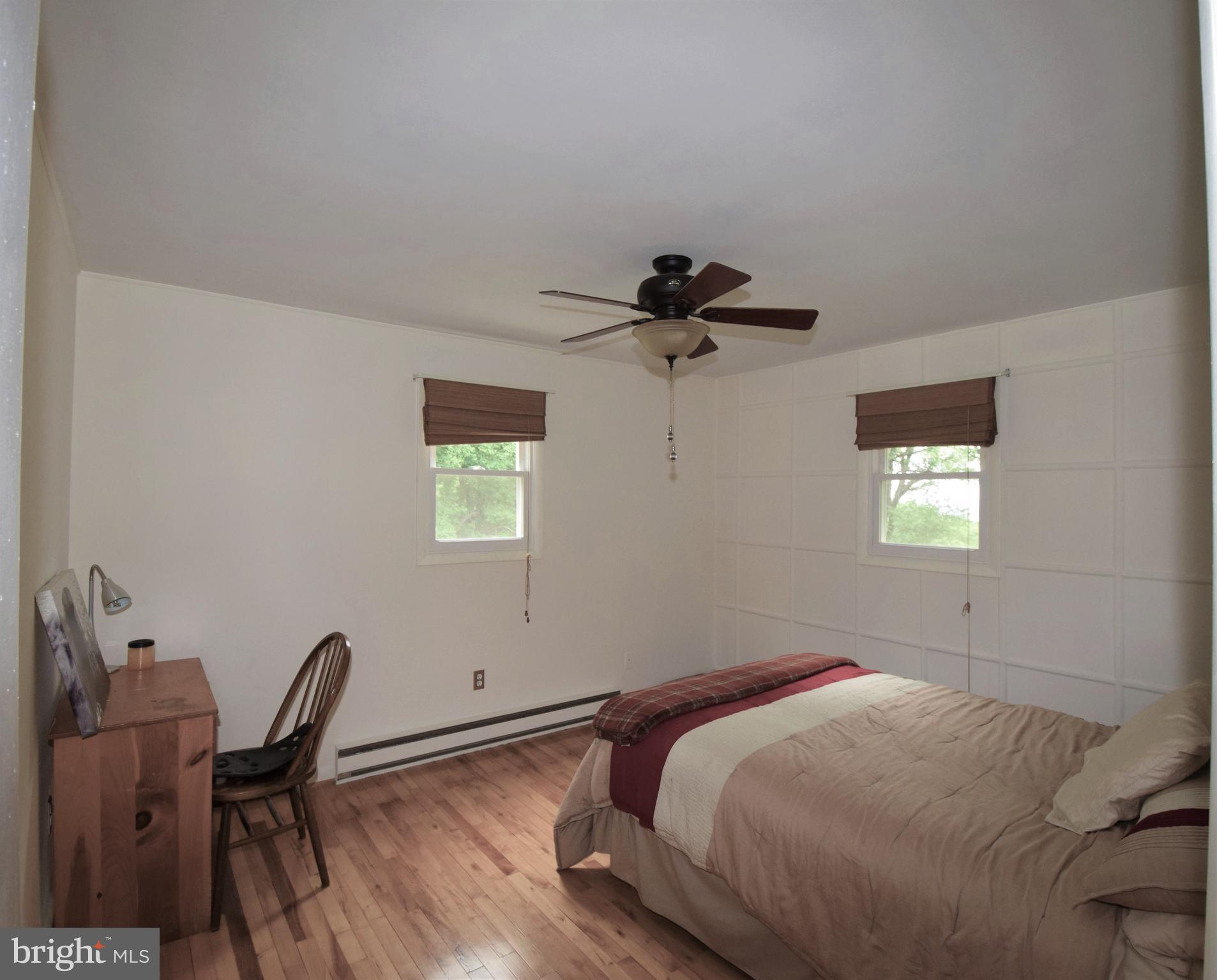 4836 Teen Barnes Road Frederick, MD 21703 - Photo 18 of 29 a bedroom with a bed and a chair