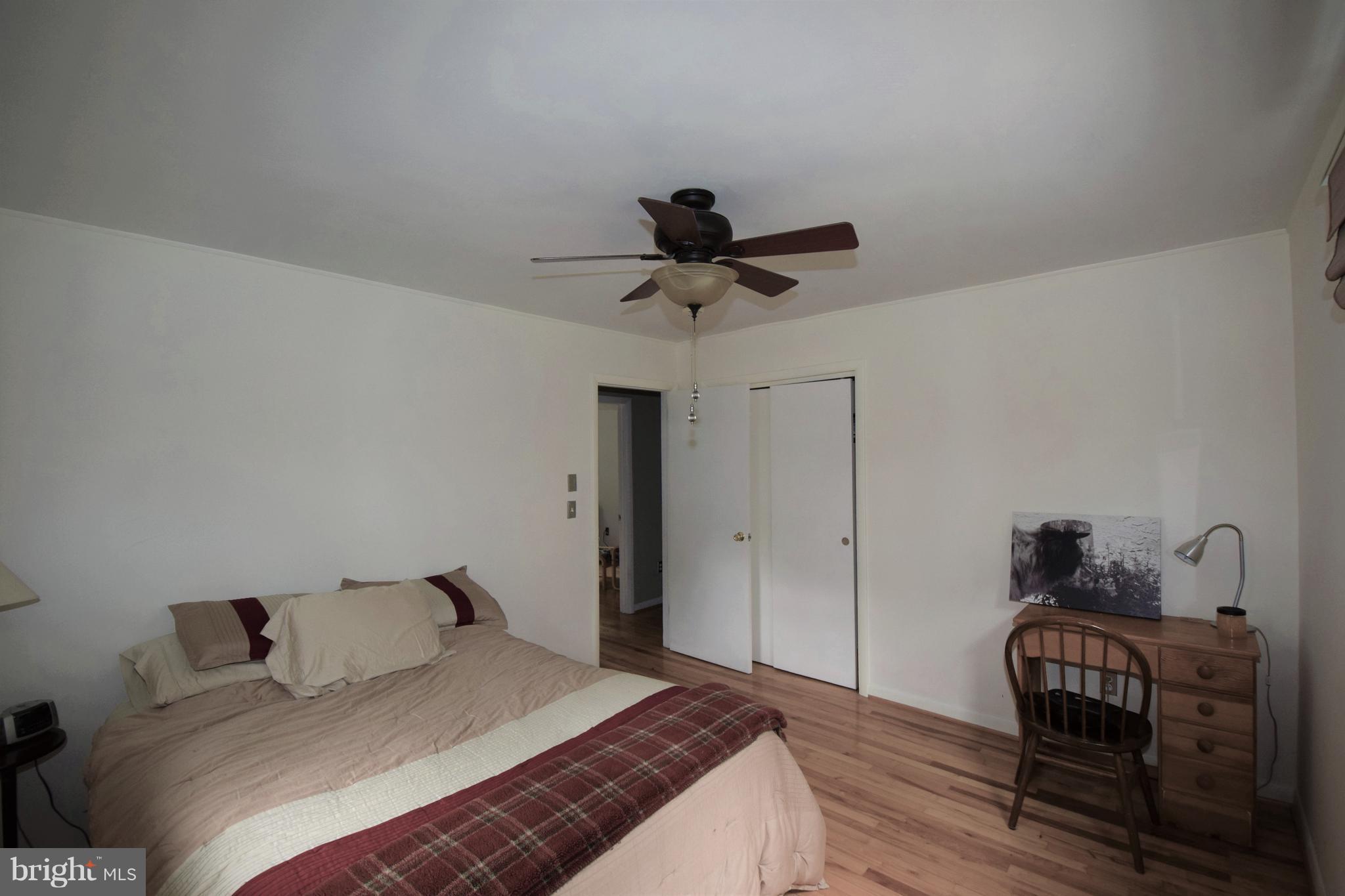 4836 Teen Barnes Road Frederick, MD 21703 - Photo 19 of 29 a bedroom with a bed and a chandelier