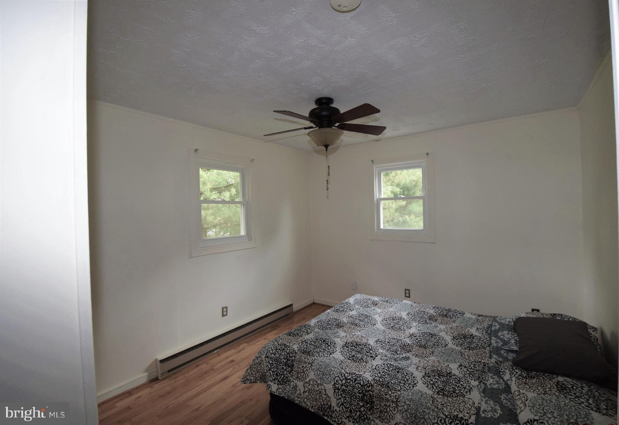 4836 Teen Barnes Road Frederick, MD 21703 - Photo 20 of 29 a bedroom with a bed and a window