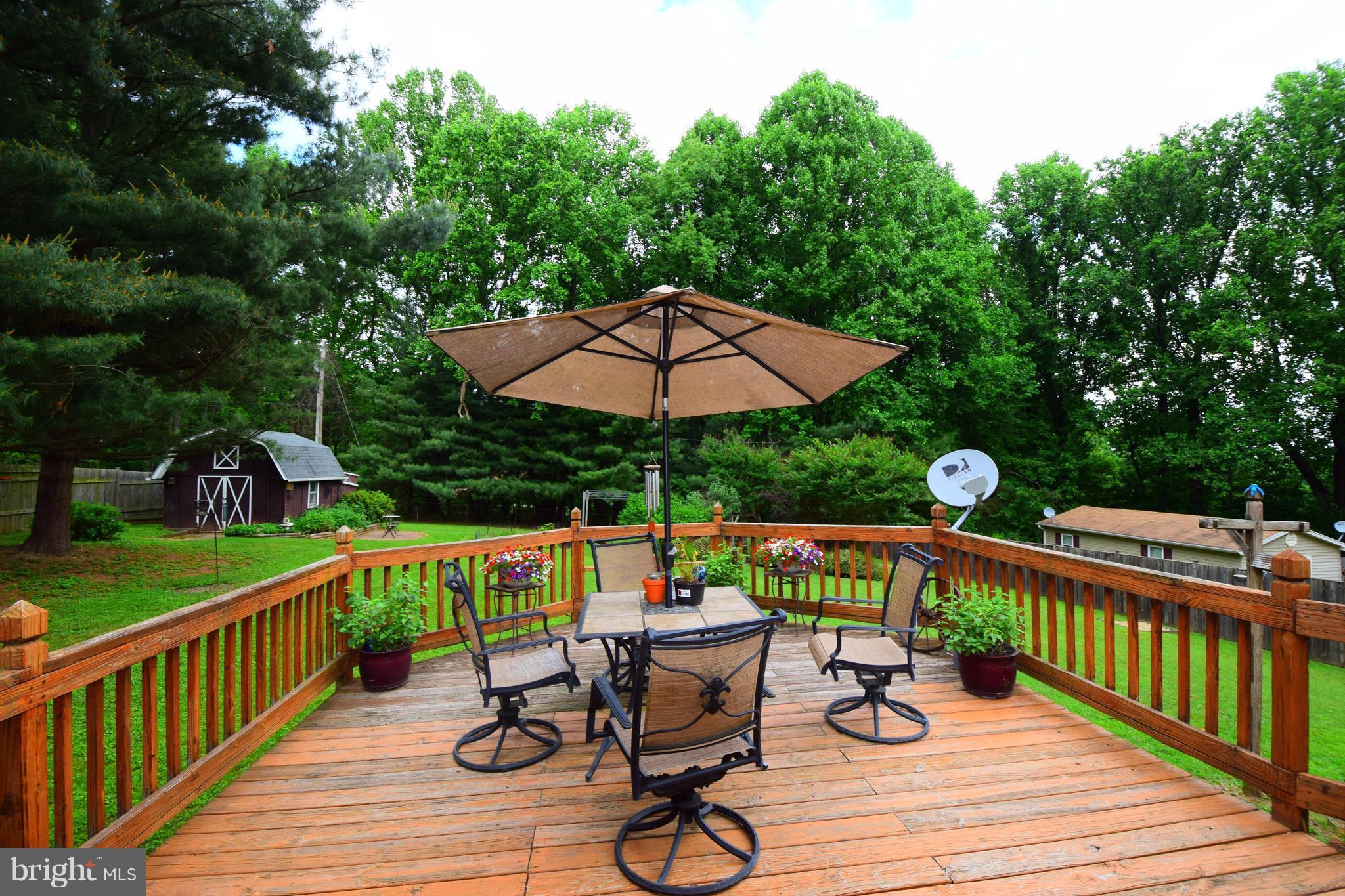 4836 Teen Barnes Road Frederick, MD 21703 - Photo 23 of 29 a view of deck with furniture and umbrella