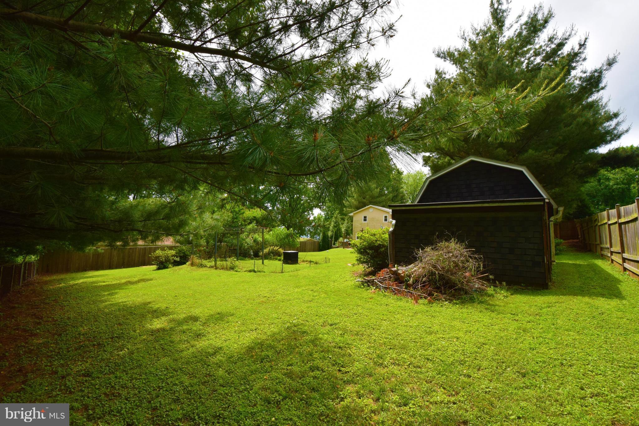 4836 Teen Barnes Road Frederick, MD 21703 - Photo 27 of 29 a backyard of a house with lots of green space