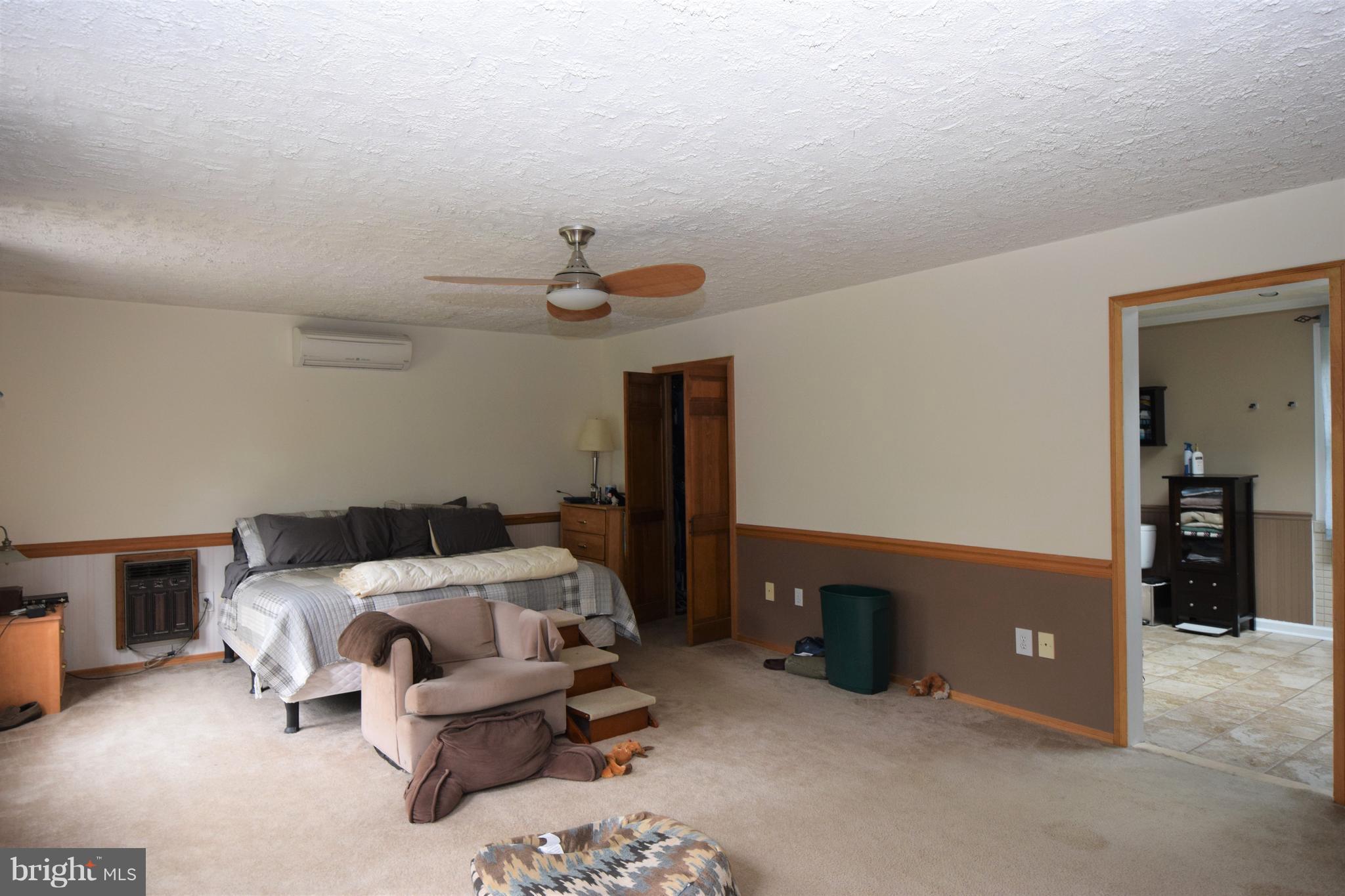4836 Teen Barnes Road Frederick, MD 21703 - Photo 5 of 29 a bedroom with a bed and cabinets