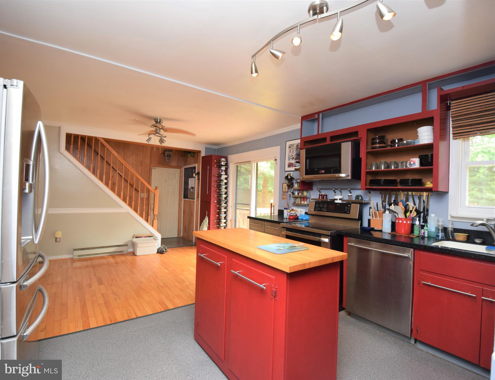 4836 Teen Barnes Road Frederick, MD 21703 - Photo 10 of 29 a kitchen with stainless steel appliances a sink stove and wooden cabinets