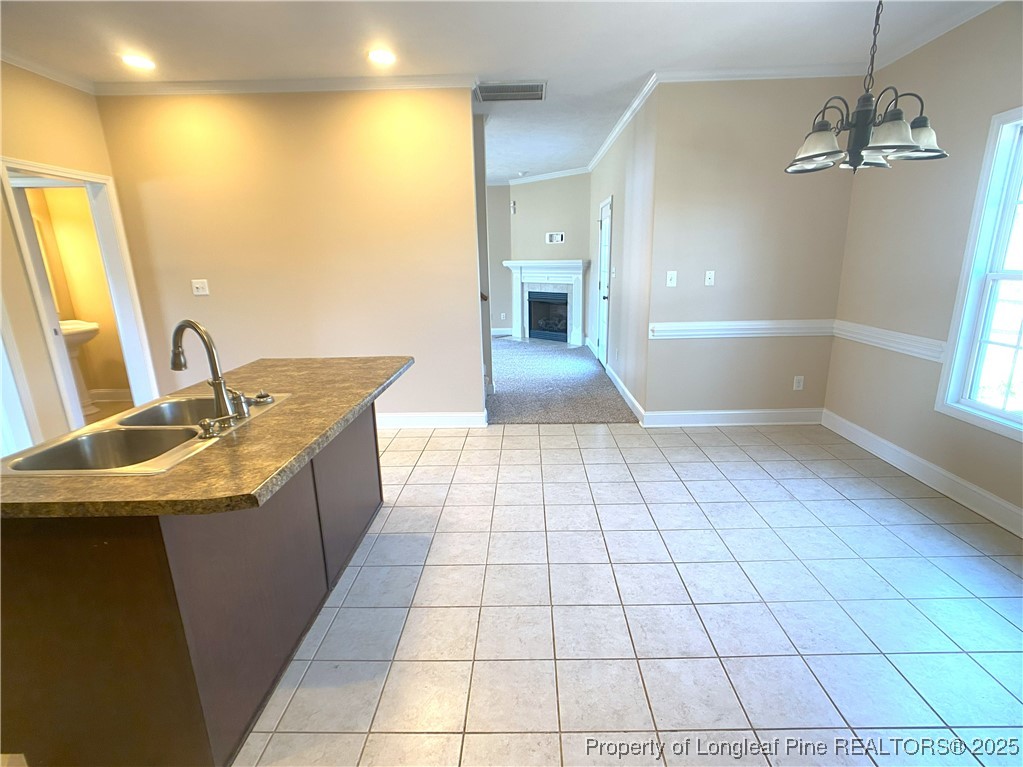 401 Regimental Drive Cameron, NC 28326 - Photo 15 of 35 a view of a bathroom with a sink and a mirror