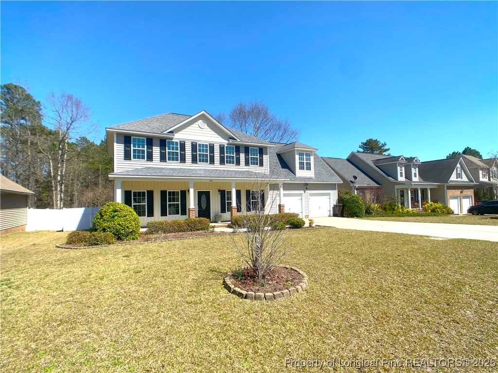 401 Regimental Drive Cameron, NC 28326 - Photo 2 of 35 a front view of a house with a yard table and chairs