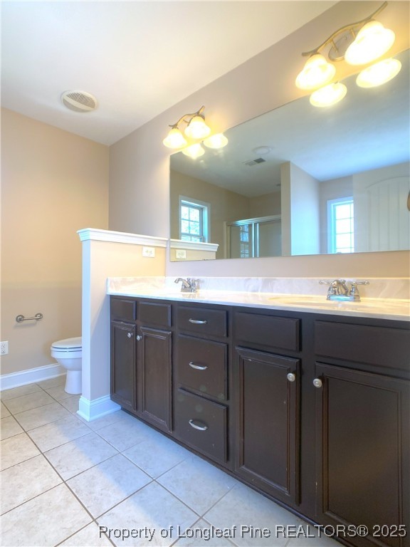 401 Regimental Drive Cameron, NC 28326 - Photo 21 of 35 a bathroom with a double vanity sink and a mirror