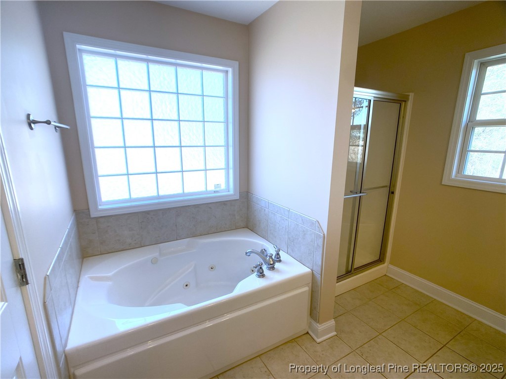 401 Regimental Drive Cameron, NC 28326 - Photo 22 of 35 a white bath tub sitting next to a window