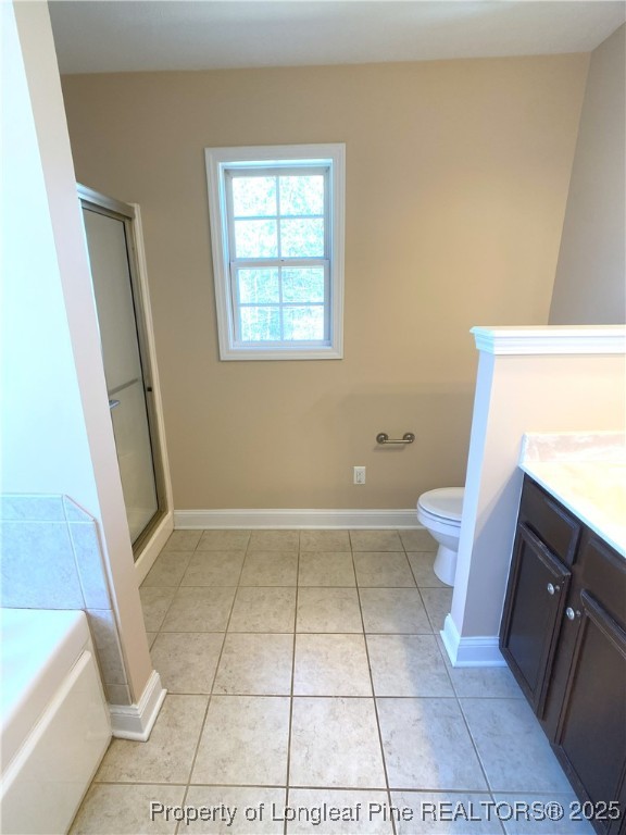 401 Regimental Drive Cameron, NC 28326 - Photo 24 of 35 a bathroom with a sink a toilet a rug and a window