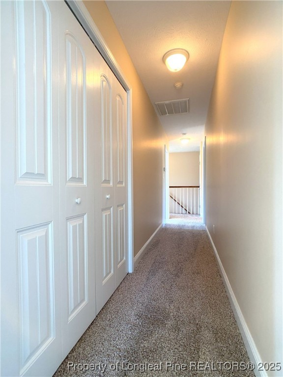 401 Regimental Drive Cameron, NC 28326 - Photo 25 of 35 a view of a hallway with wooden floor