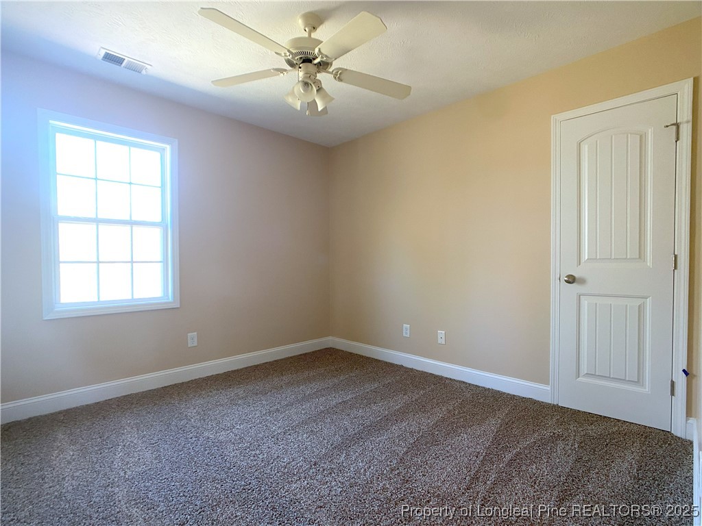 401 Regimental Drive Cameron, NC 28326 - Photo 26 of 35 wooden floor in an empty room with a window
