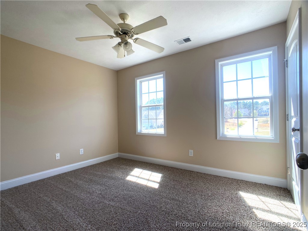 401 Regimental Drive Cameron, NC 28326 - Photo 28 of 35 a view of an empty room with a window