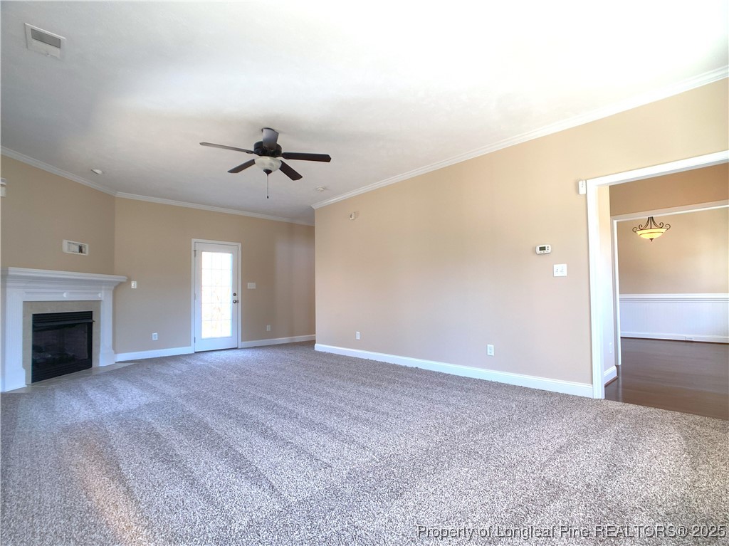 401 Regimental Drive Cameron, NC 28326 - Photo 7 of 35 a view of a livingroom with a ceiling fan and window