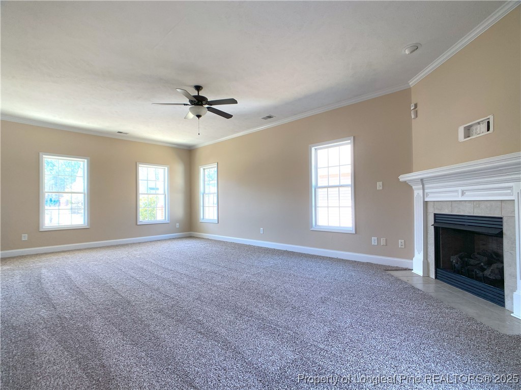 401 Regimental Drive Cameron, NC 28326 - Photo 8 of 35 a view of empty room with fireplace and windows