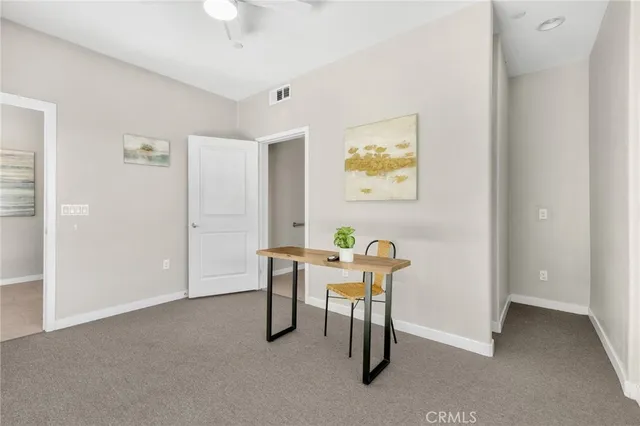 a workspace with furniture and window