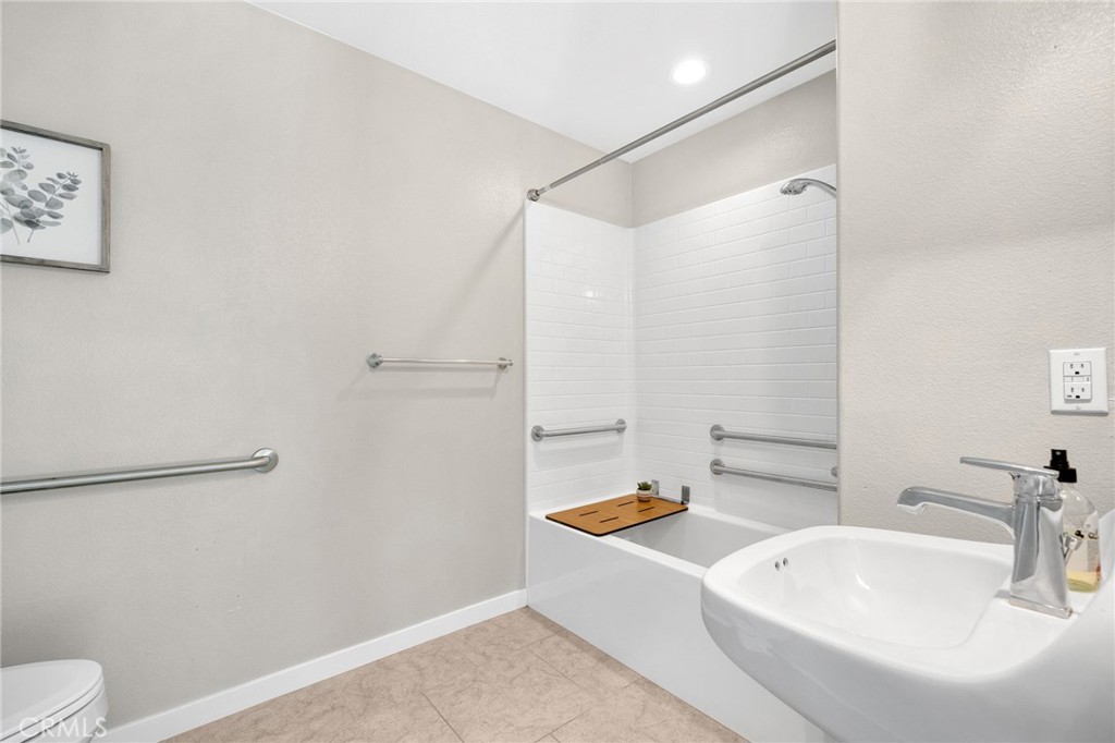 746 Farrier Way Upland, CA 91786 - Photo 21 of 45 a bathroom with a sink a toilet a shower and a mirror