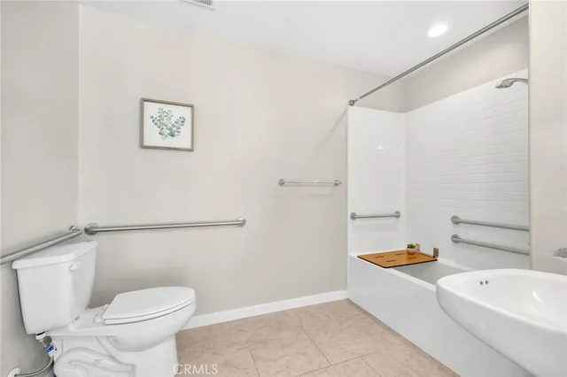 a bathroom with a toilet and a bathtub