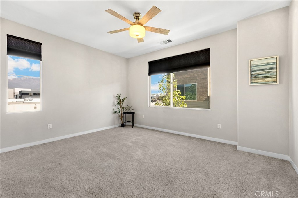 746 Farrier Way Upland, CA 91786 - Photo 23 of 45 an empty room with windows and fan