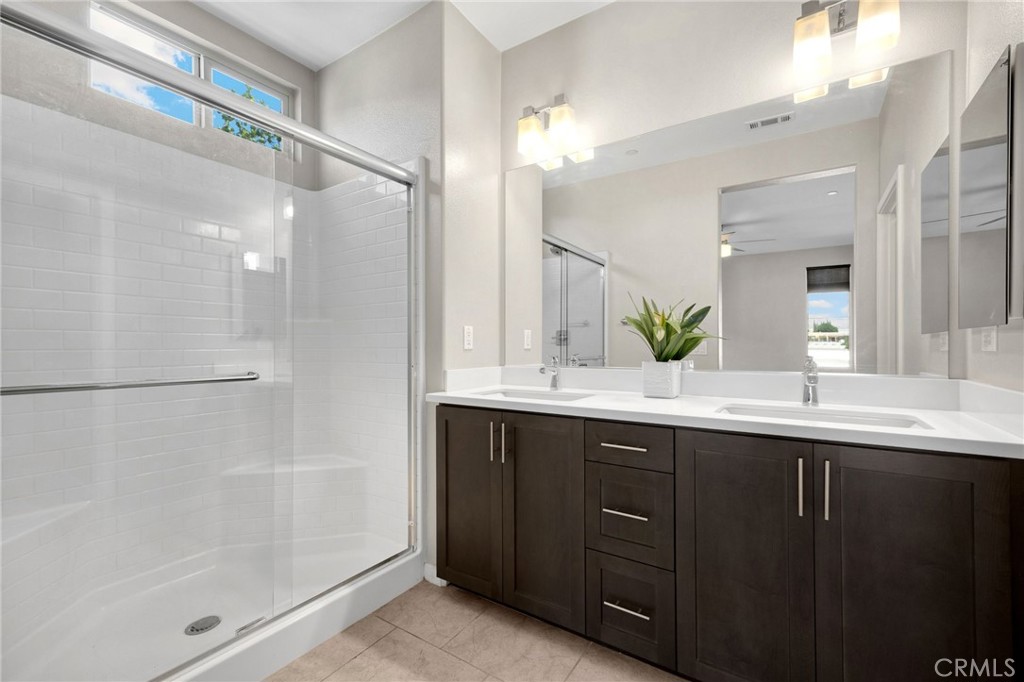 746 Farrier Way Upland, CA 91786 - Photo 25 of 45 a bathroom with a double vanity sink and mirror