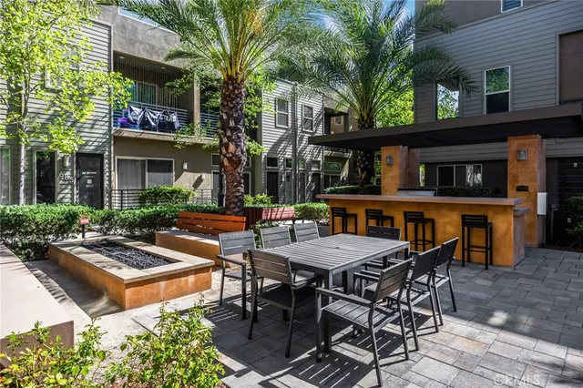 a view of a dinning table and chairs in the patio