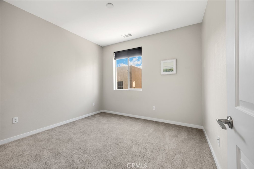 746 Farrier Way Upland, CA 91786 - Photo 32 of 45 a view of an empty room with a window