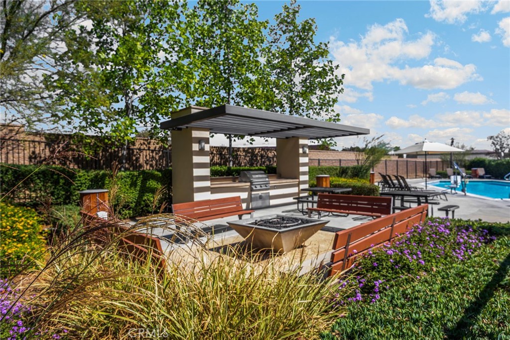 746 Farrier Way Upland, CA 91786 - Photo 4 of 45 a view of a patio with table and chairs potted plants with wooden fence