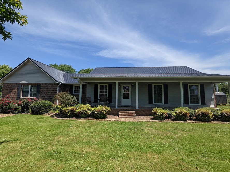 6 Power Station Road Taft, TN 38488 - Photo 1 of 29 a front view of a house with a garden