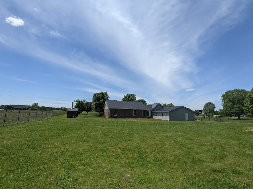 6 Power Station Road Taft, TN 38488 - Photo 11 of 29 a view of a big yard with a house in the background
