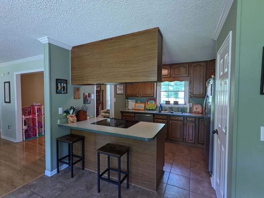 6 Power Station Road Taft, TN 38488 - Photo 14 of 29 a kitchen with stainless steel appliances granite countertop a sink and a refrigerator