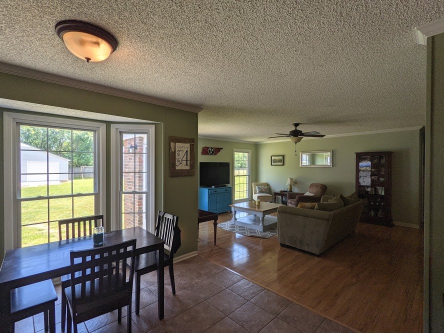 6 Power Station Road Taft, TN 38488 - Photo 19 of 29 a living room with furniture a flat screen tv and a large window