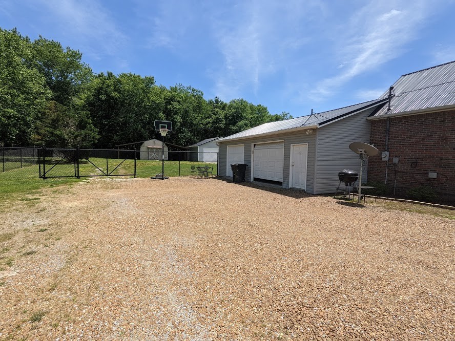 6 Power Station Road Taft, TN 38488 - Photo 8 of 29 a house with trees in the background