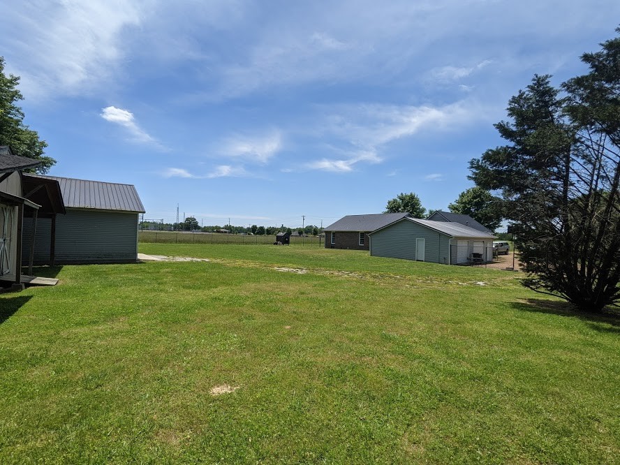 6 Power Station Road Taft, TN 38488 - Photo 10 of 29 a front view of a house with garden
