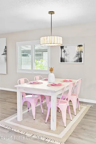 a very nice looking dining room with a table and chairs