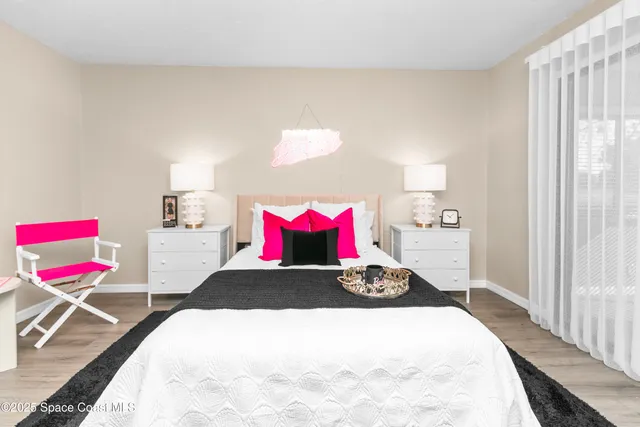 a bedroom with a bed and window